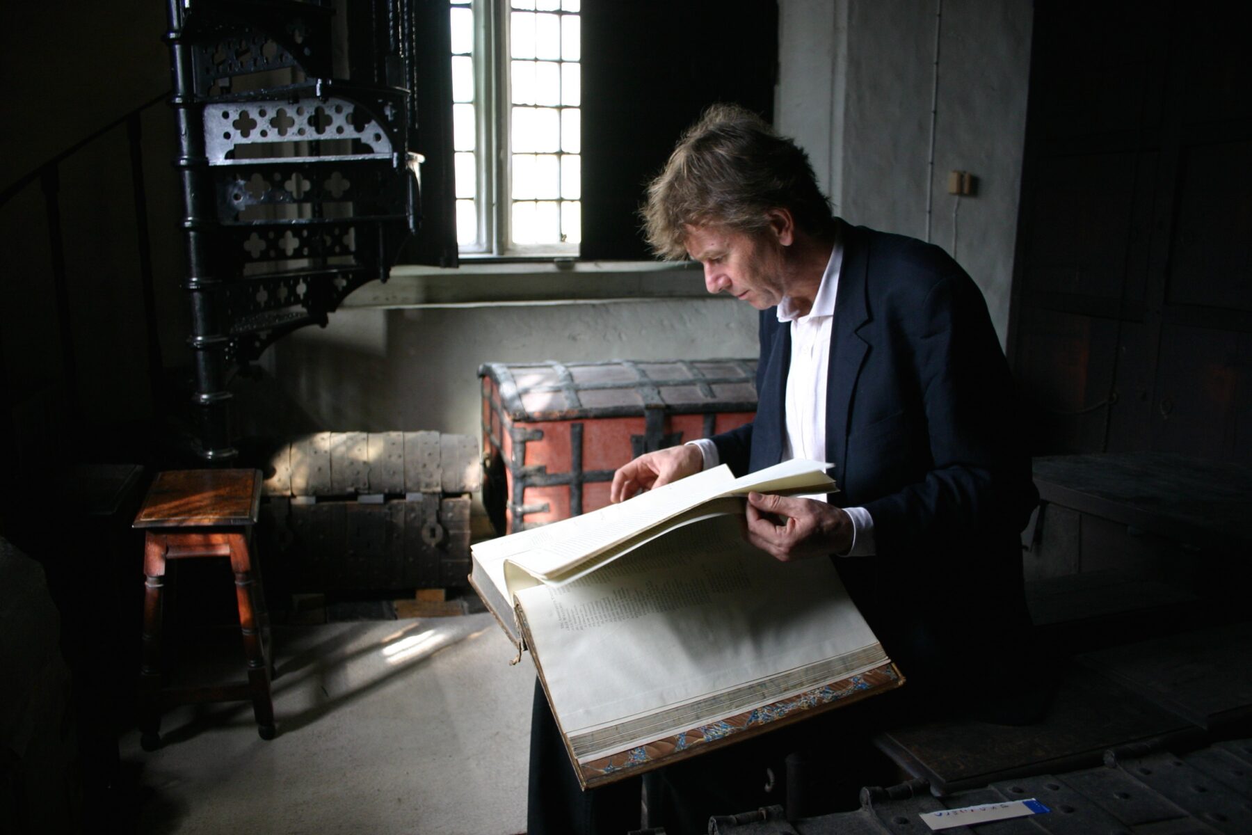 professor michael wood sat researching in an historic house