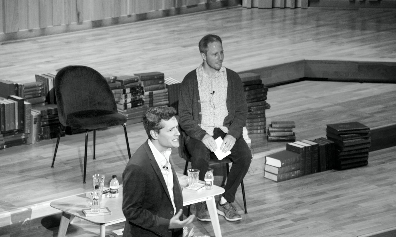 jack symes and philip goff speaking at an event