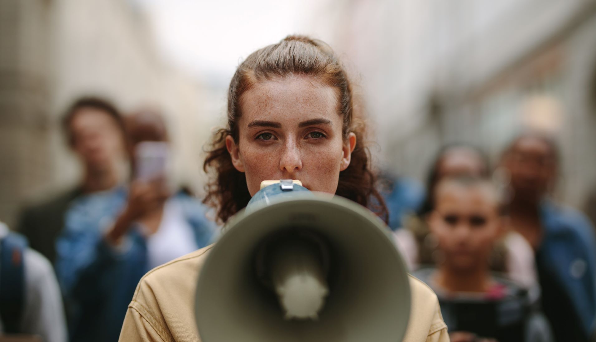 female activist protesting with megaphone